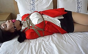 Oriental In Red-hot Suit Bound And Gagged
